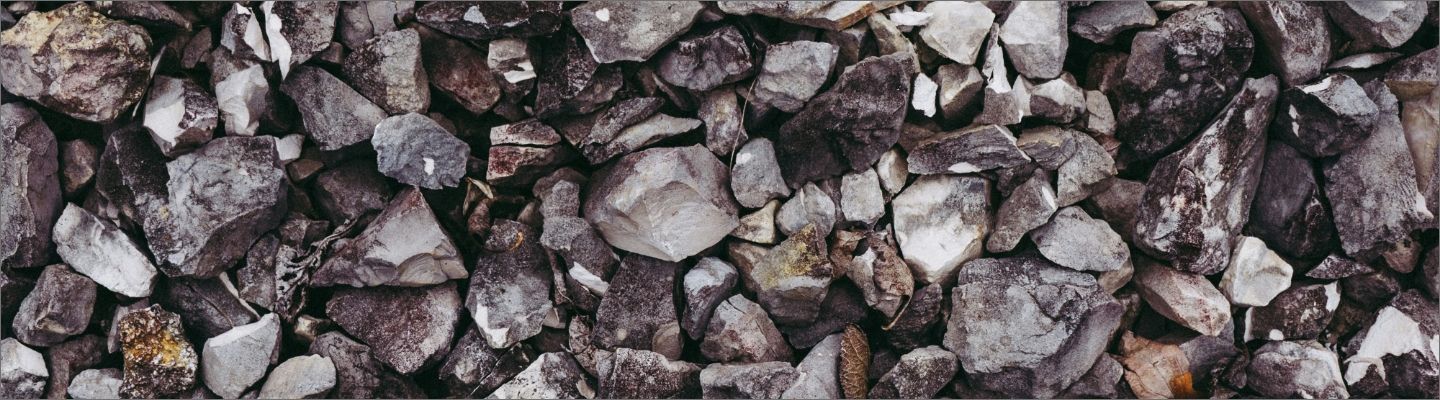 A background image used on the Weimer Bearing website design, highlighting use of texture through a photo of rocks related to the mining industry.