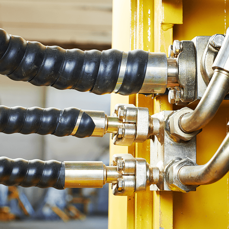 Closeup of a hydraulic system with hoses